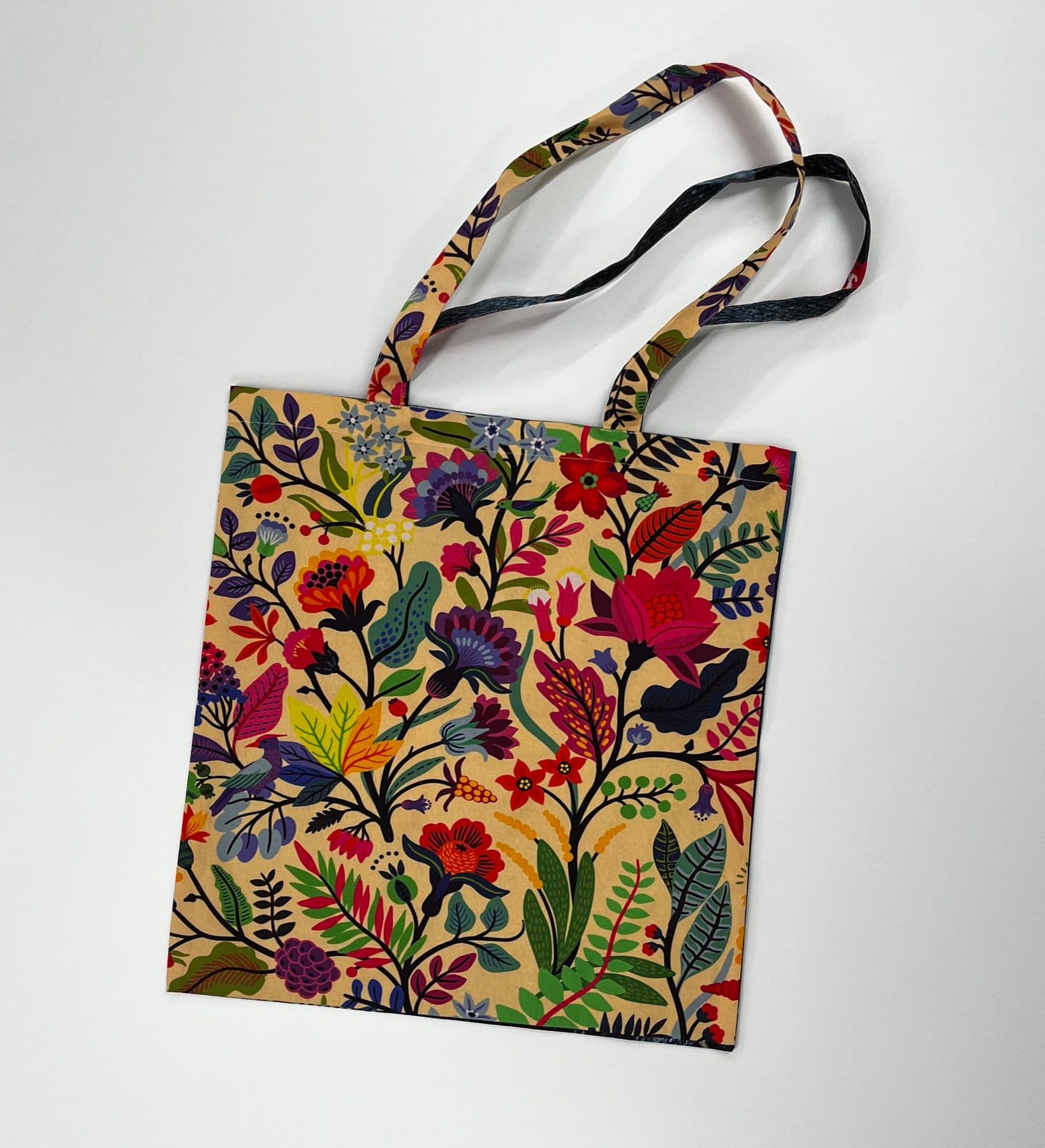 Tote bag printed edge to edge with a floral design